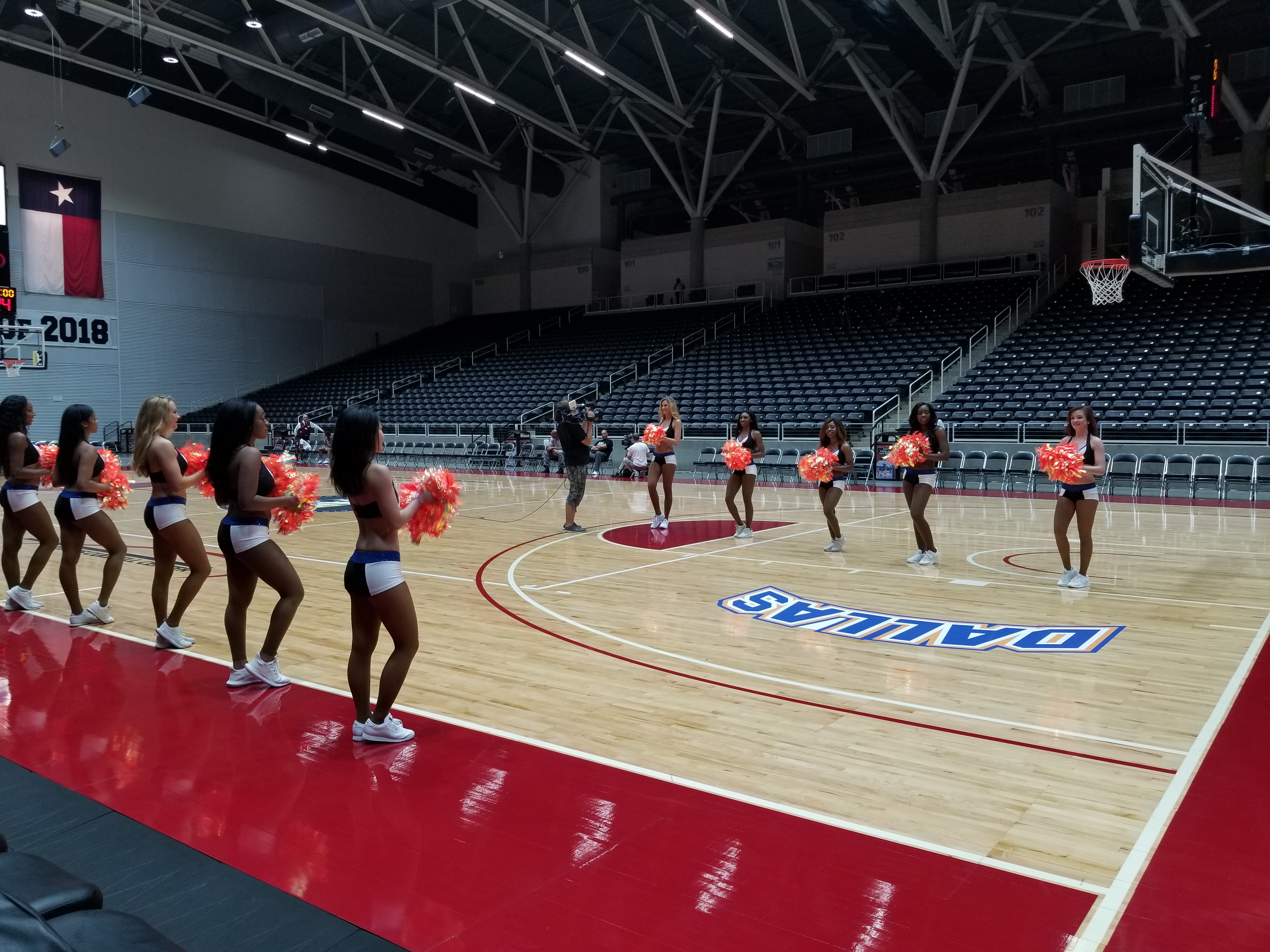 Dallas Mavericks dancers rehearsing on court
